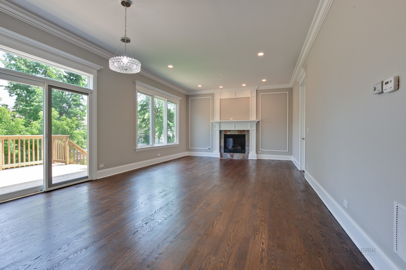 1747 Greenwood Road Glenview, IL 60026 - Photo 10 of 46 a view of an empty room with wooden floor and a window