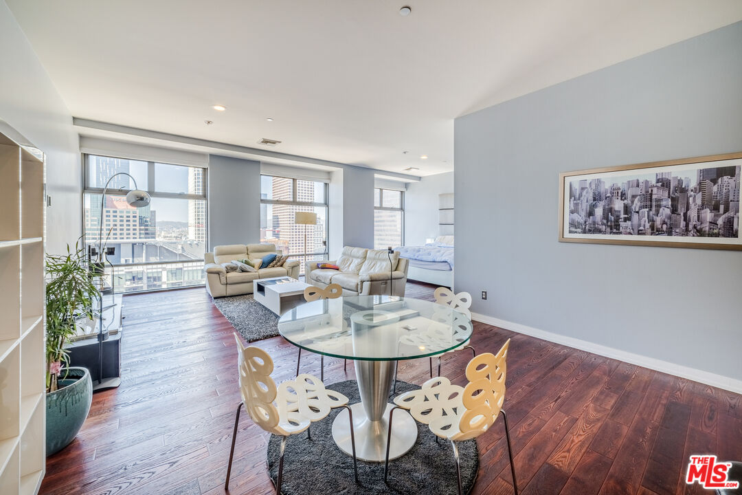 801 South Grand Avenue, Unit 2104 Los Angeles, CA 90017 - Photo 1 of 36 a view of a dining room with furniture window and wooden floor