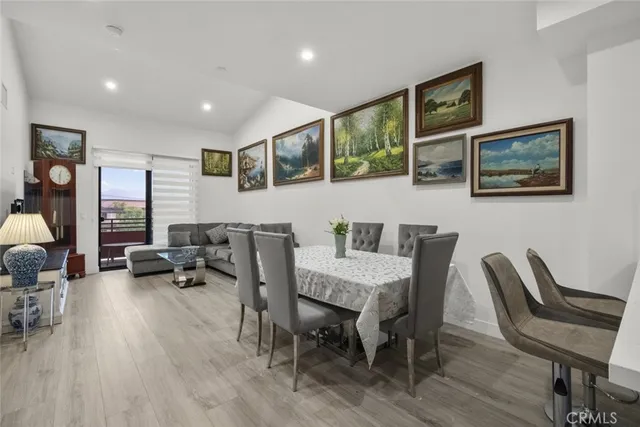 a kitchen with stainless steel appliances granite countertop a stove a refrigerator and a sink