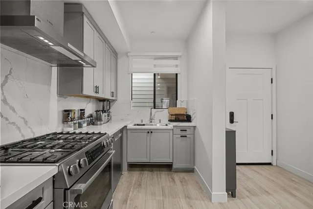 a kitchen with a refrigerator and stove