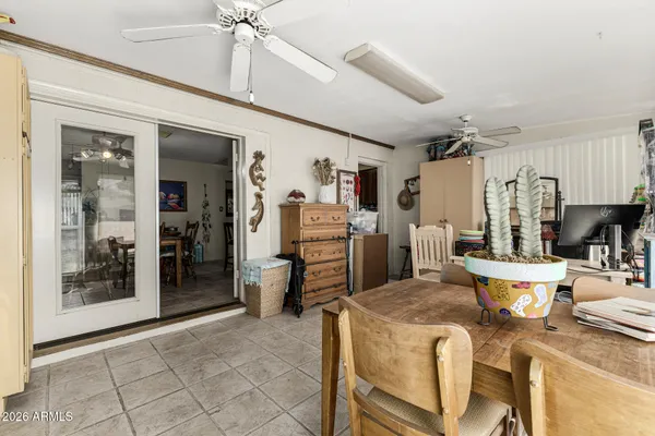 a kitchen with a table and chairs