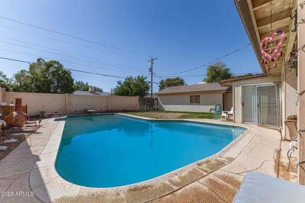 a view of a swimming pool with a patio