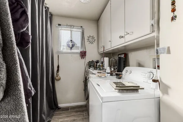 a view of living room with washer and dryer