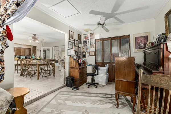 a view of a livingroom with furniture and a flat screen tv