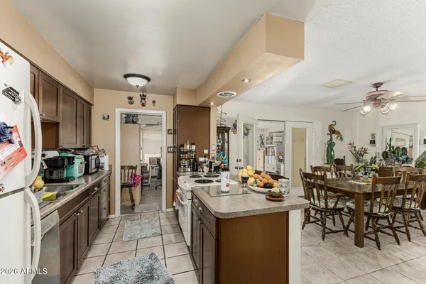 a kitchen with lots of counter top space and dining table