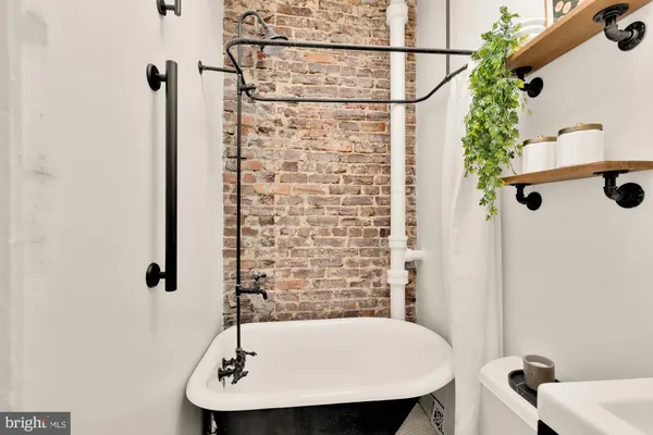 a bathroom with a sink and shower