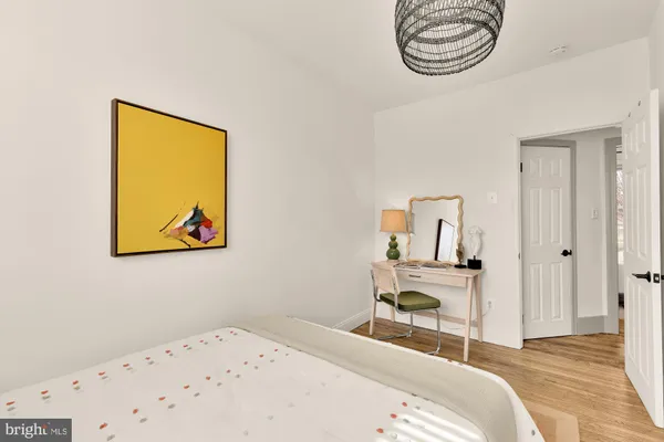 a bedroom with a bed and a lamp