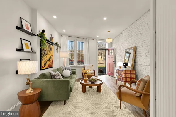 a living room with furniture and a painting on the wall