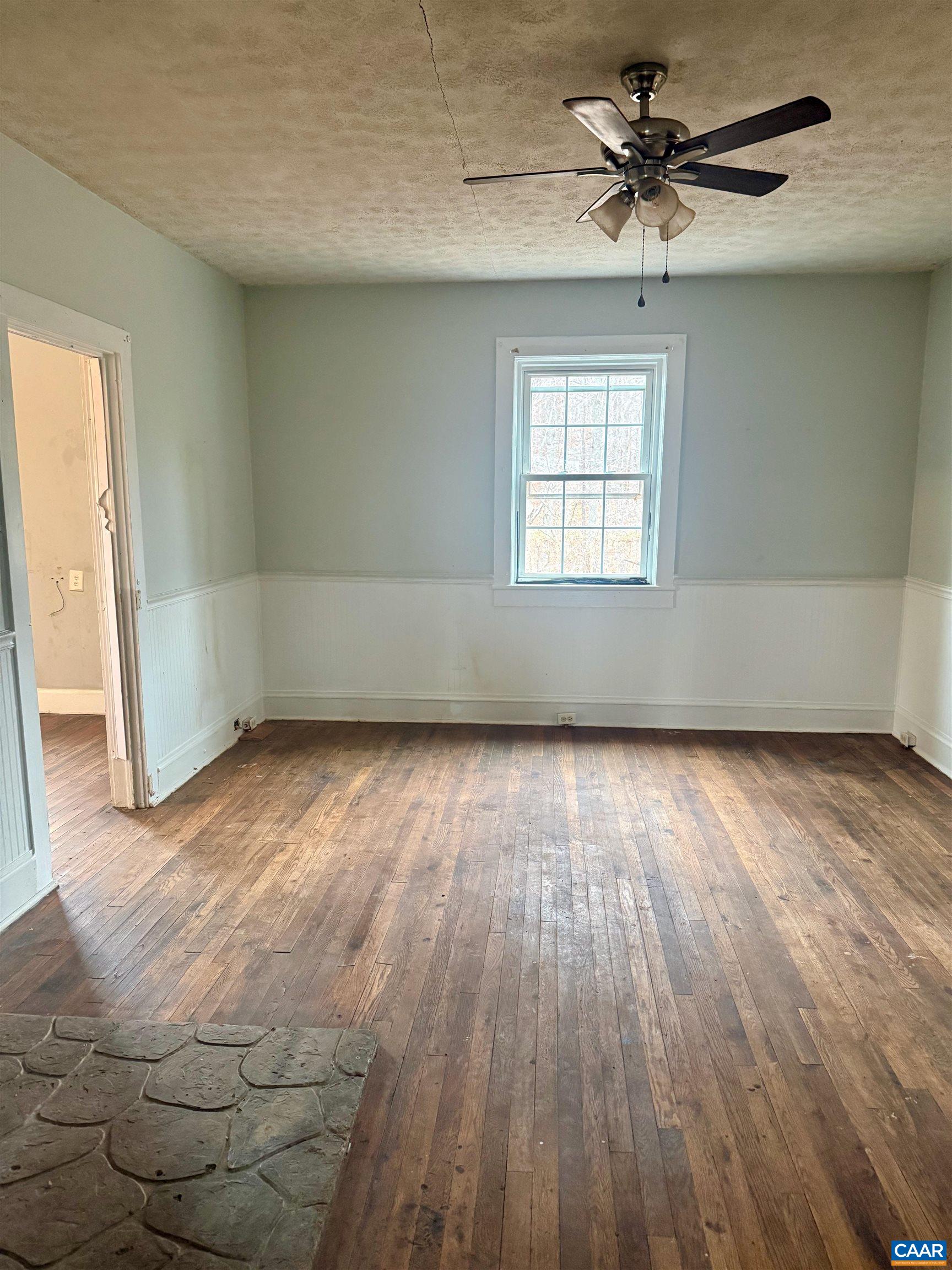 3127 Courthouse Road Palmyra, VA 22963 - Photo 5 of 16 wooden floor in an empty room with a window