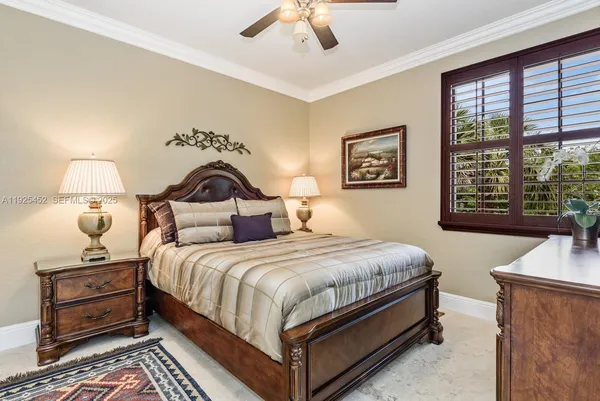 a bedroom with a bed and a night stand