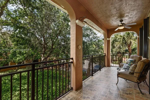 a view of balcony with furniture