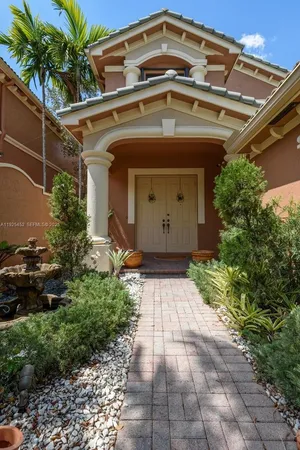 a front view of a house with garden