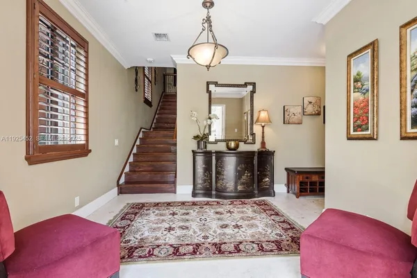 a bedroom with a bed and a dresser in it