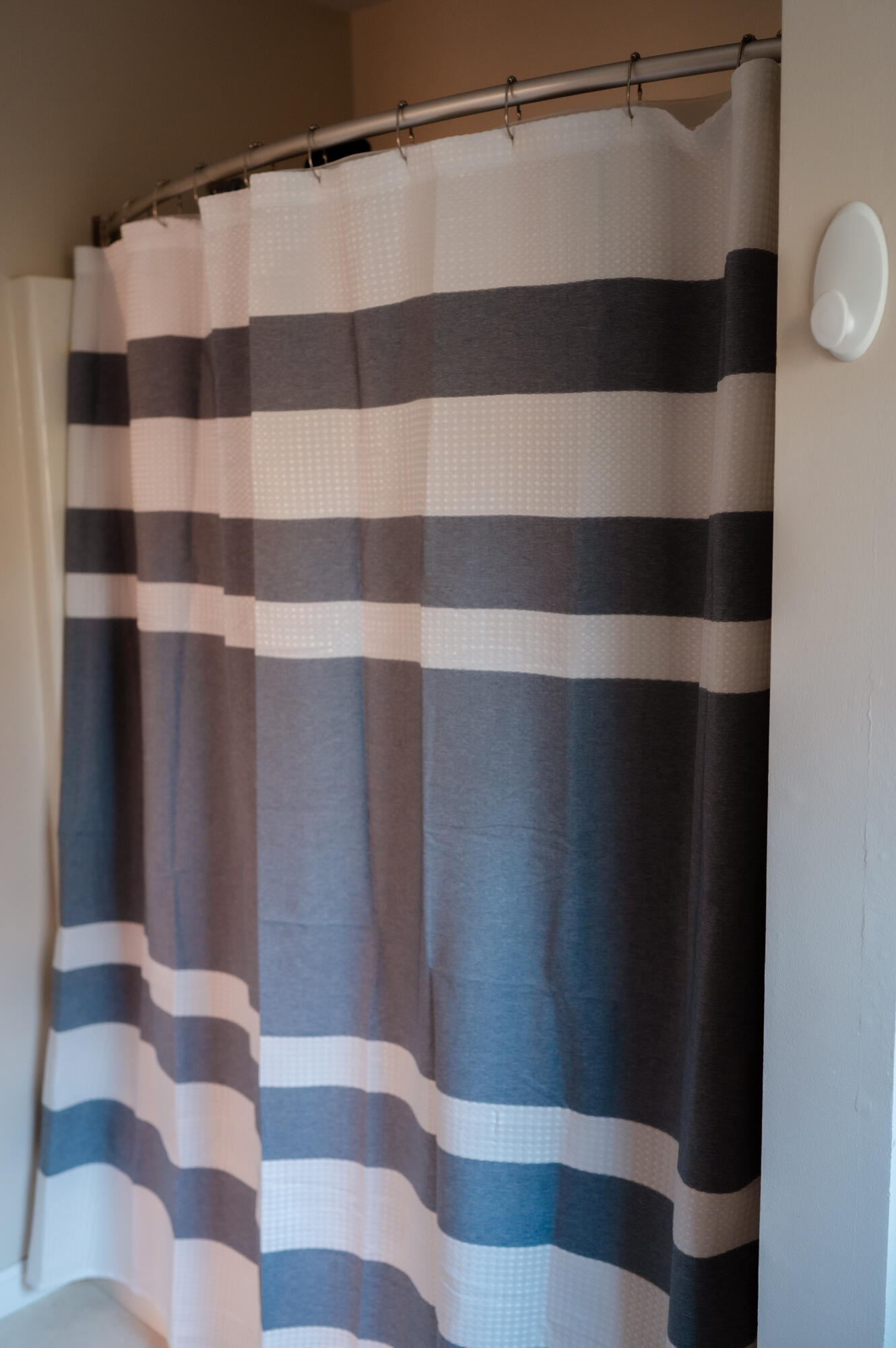 208 Irenes Way Tisbury, MA 02568 - Photo 31 of 70 a bathroom with a black and white checkered curtain