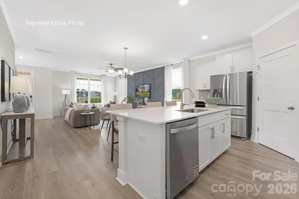 a kitchen with a refrigerator and a sink