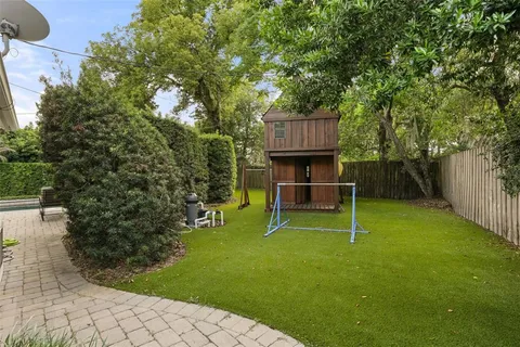 a view of a backyard with a small cabin