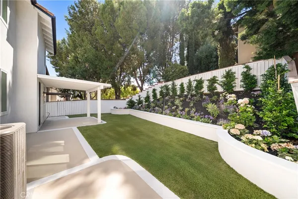 a view of a back yard of the house