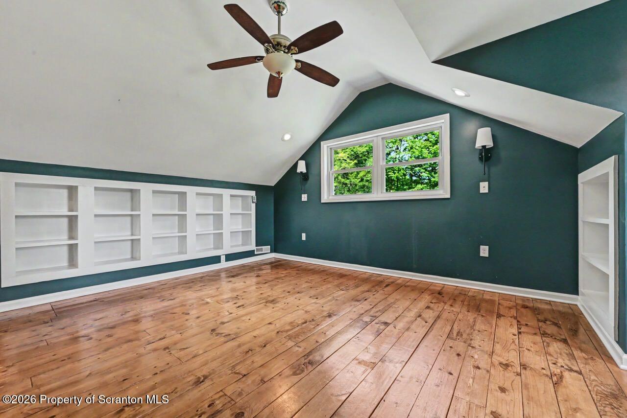 457 Craig Road Dalton, PA 18414 - Photo 75 of 114 en empty room with window and ceiling fan