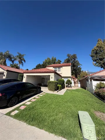 a view of a house with a yard porch and sitting area
