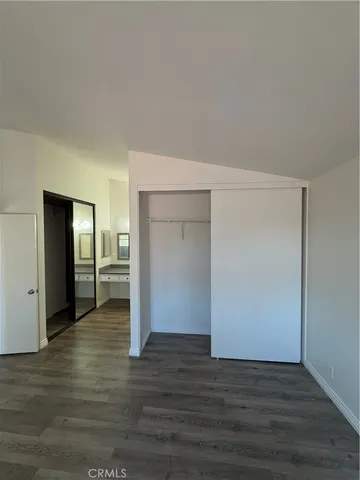a view of a kitchen with wooden floor