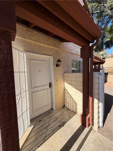 a view of a house with backyard and porch