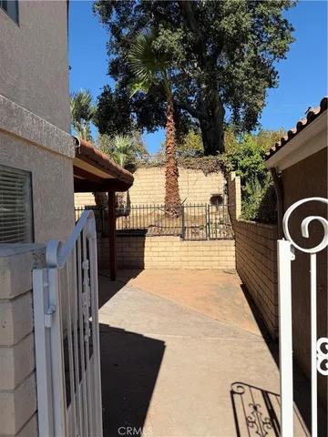 a view of room with wooden floor