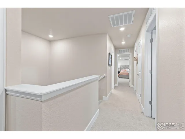 a bathroom with a double vanity sink mirror and shower