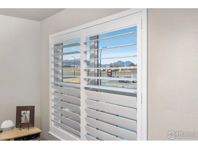 a bedroom with bed and a chandelier