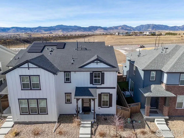 an aerial view of a house with a lake view