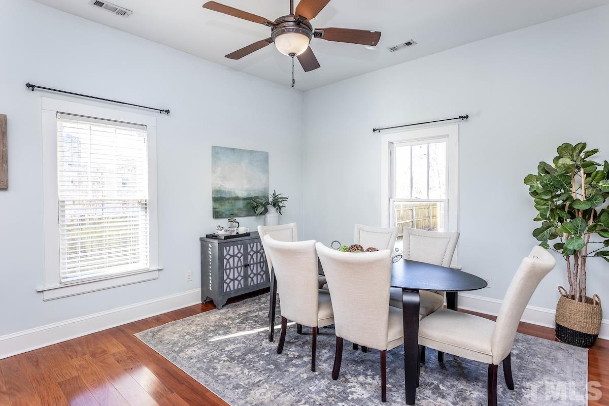 529 East Martin Street Raleigh, NC 27601 - Photo 15 of 29 a view of a dining room with furniture window and wooden floor