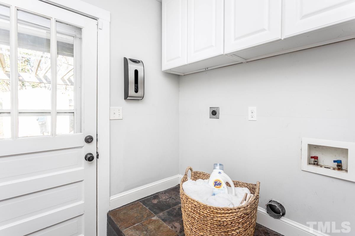 529 East Martin Street Raleigh, NC 27601 - Photo 16 of 29 a bathroom with a toilet a sink and mirror