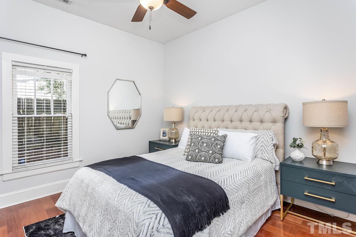 529 East Martin Street Raleigh, NC 27601 - Photo 17 of 29 a bedroom with a bed and a window