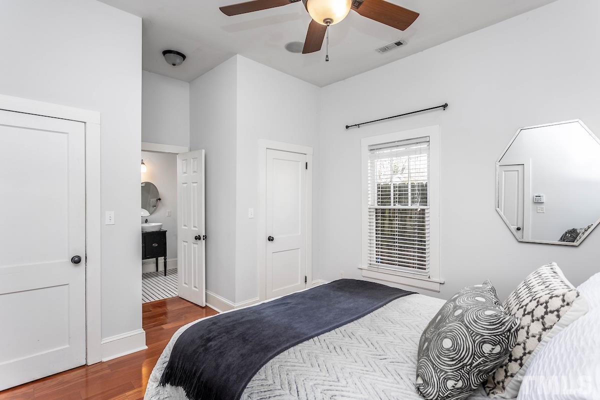 529 East Martin Street Raleigh, NC 27601 - Photo 18 of 29 a bedroom with a bed and a window
