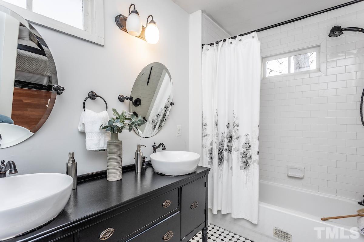 529 East Martin Street Raleigh, NC 27601 - Photo 20 of 29 a bathroom with a sink a toilet and shower