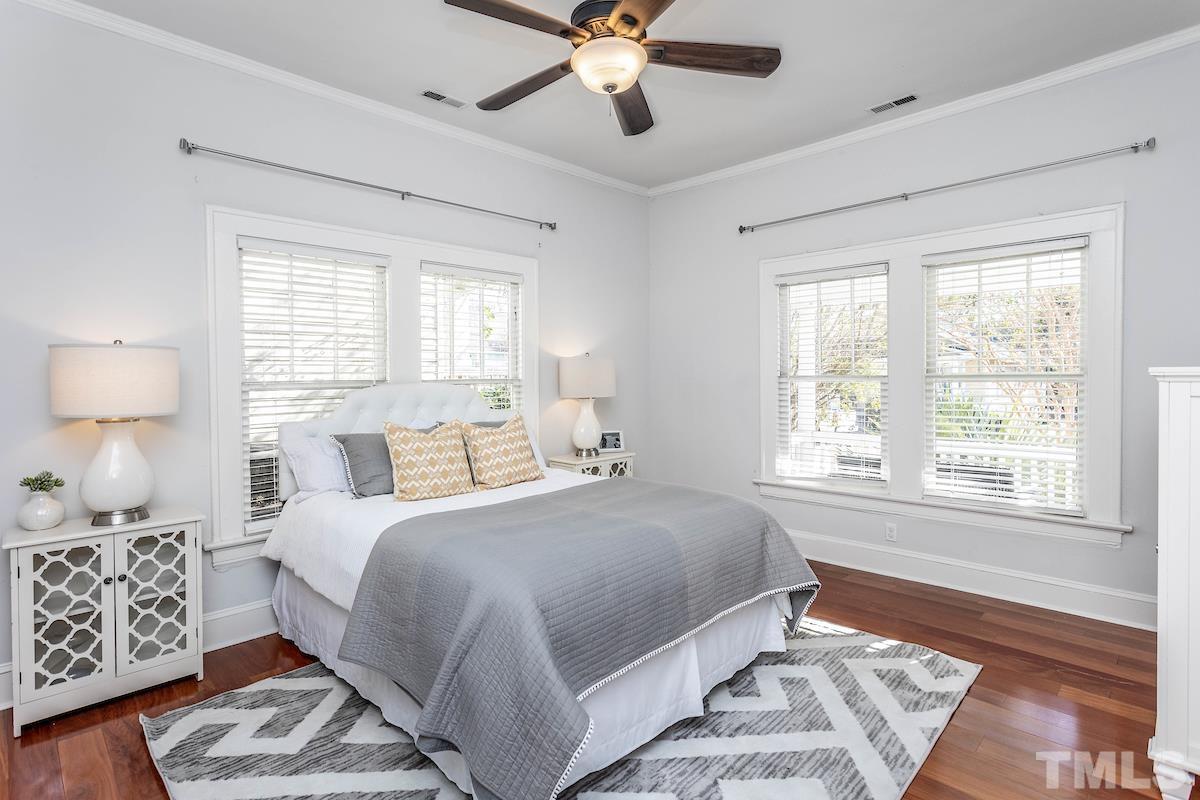 529 East Martin Street Raleigh, NC 27601 - Photo 22 of 29 a bedroom with a large bed and a window