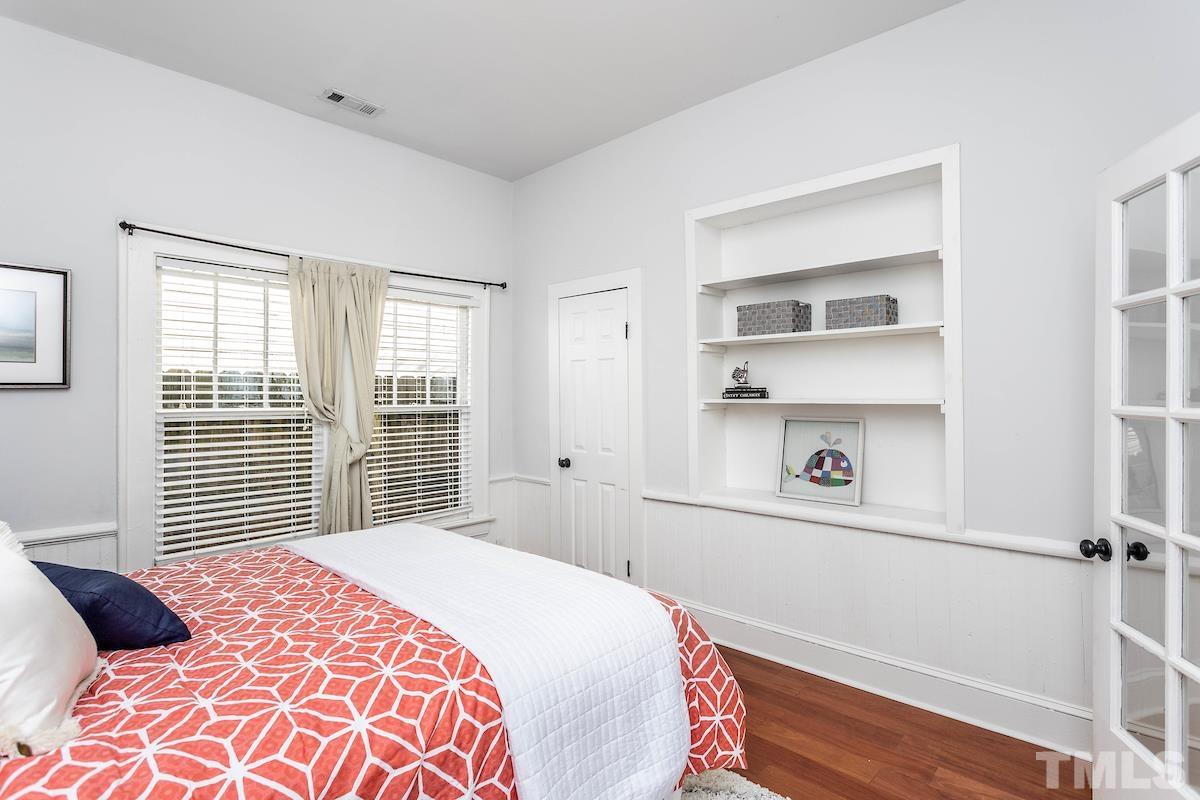 529 East Martin Street Raleigh, NC 27601 - Photo 23 of 29 a bedroom with a bed and a window