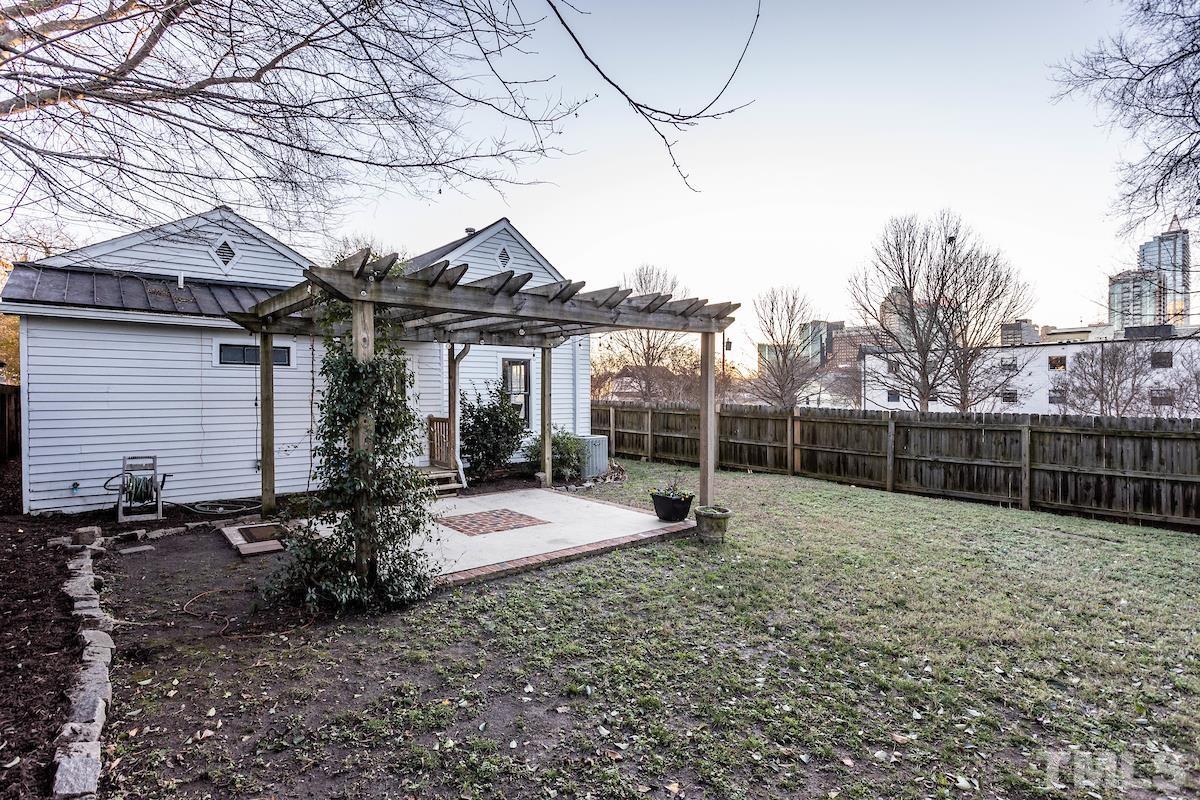 529 East Martin Street Raleigh, NC 27601 - Photo 28 of 29 a view of a house with a backyard and porch