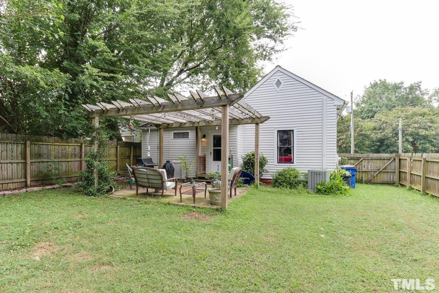 529 East Martin Street Raleigh, NC 27601 - Photo 4 of 29 a view of a house with a yard and sitting area