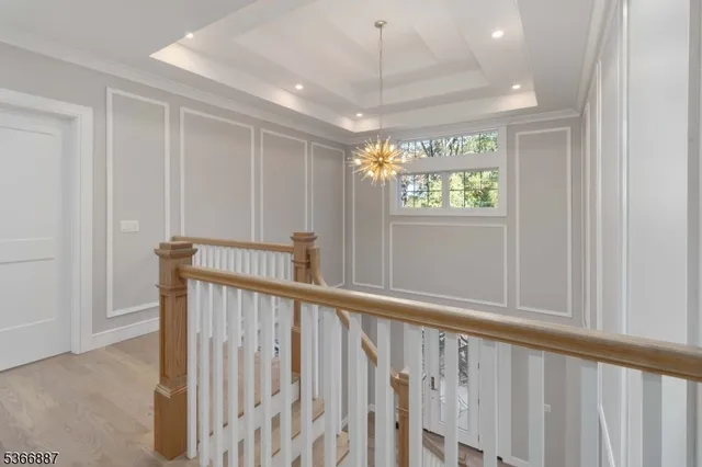a spacious bathroom with a tub sink and mirror
