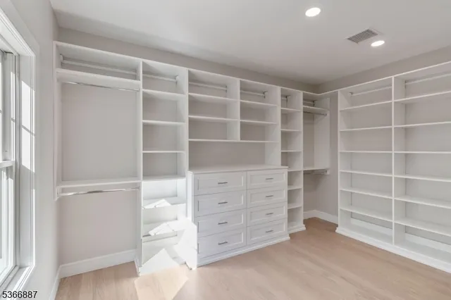 a view of an empty walk in closet
