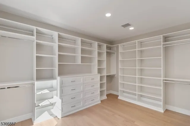 a kitchen with granite countertop a sink a stove and cabinets