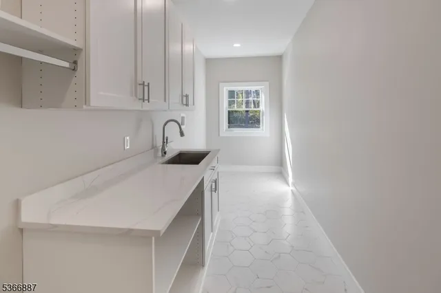 a bathroom with a vanity and a shower