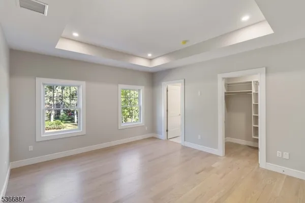 a view of an empty room with a fireplace