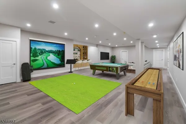 a media room with lots of chairs and a projector screen