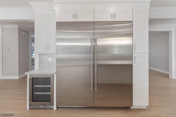 a view of a kitchen with a sink and cabinets