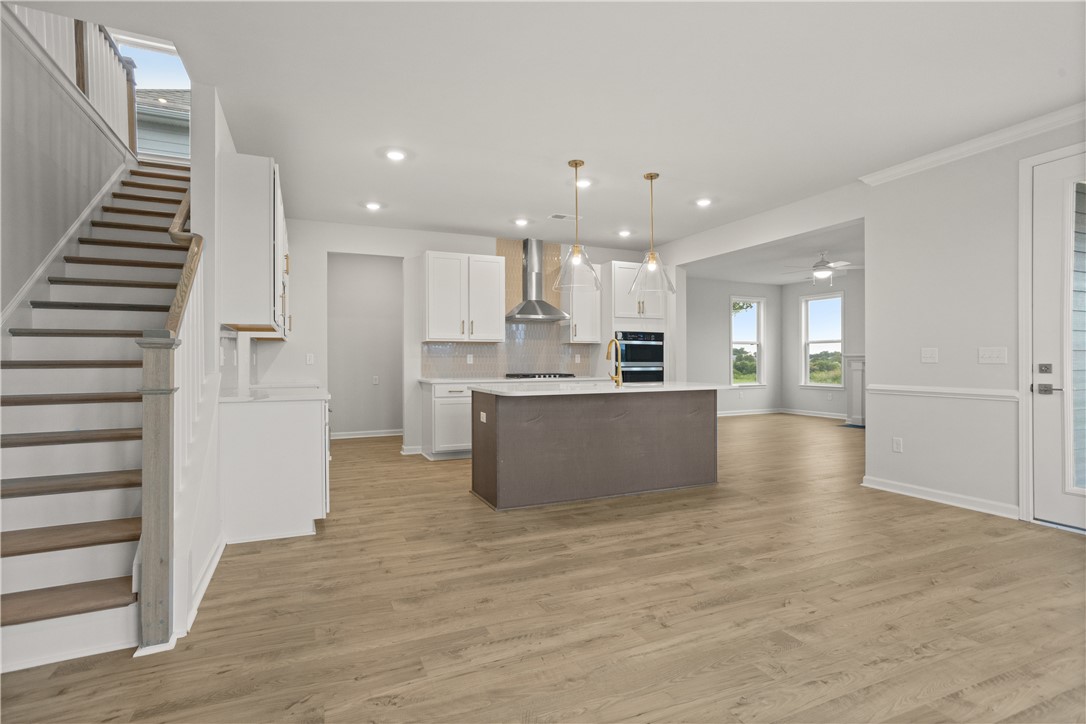 631 Sweetspire Trail, Unit 148 Seneca, SC 29678 - Photo 5 of 36 An open-concept design seamlessly connects the kitchen with a spacious living area, ideal for modern living.