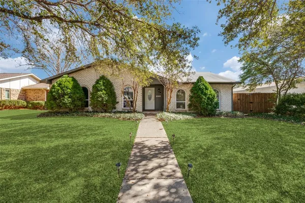 front view of a house with a yard