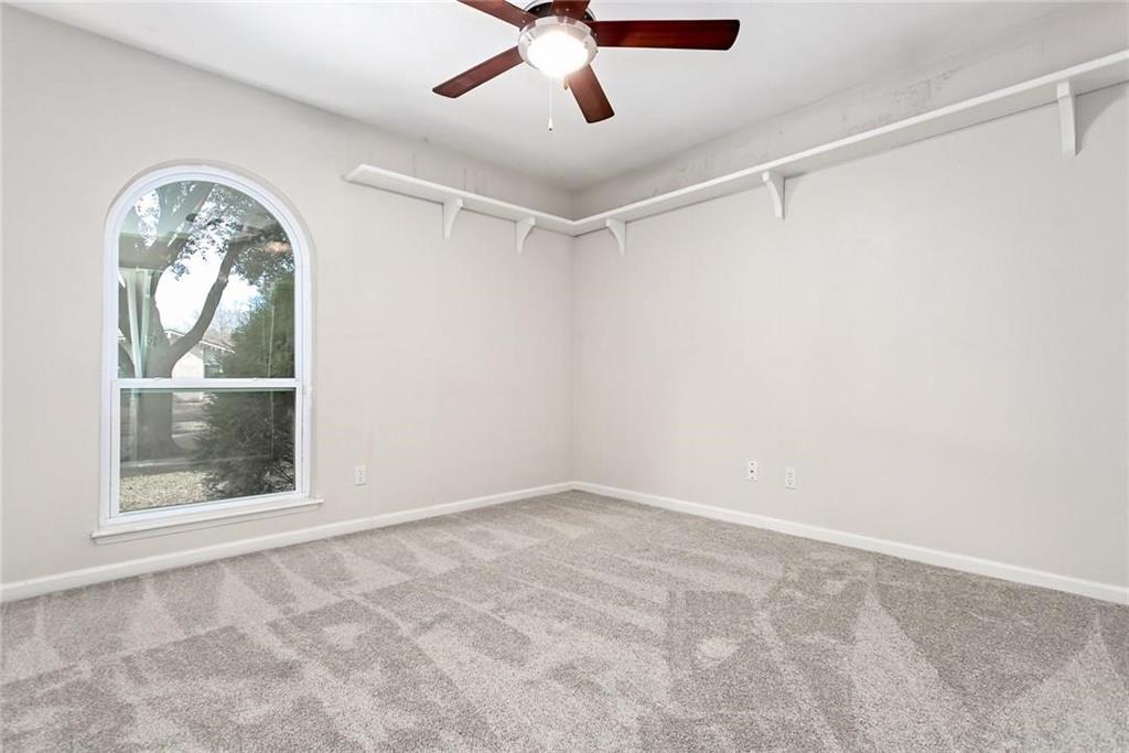 5000 Goodwin Drive Plano, TX 75023 - Photo 12 of 16 an empty room with windows and fan