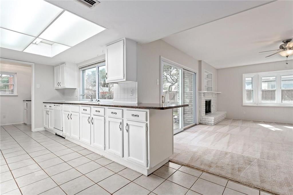 5000 Goodwin Drive Plano, TX 75023 - Photo 16 of 16 a kitchen with granite countertop a sink cabinets and window
