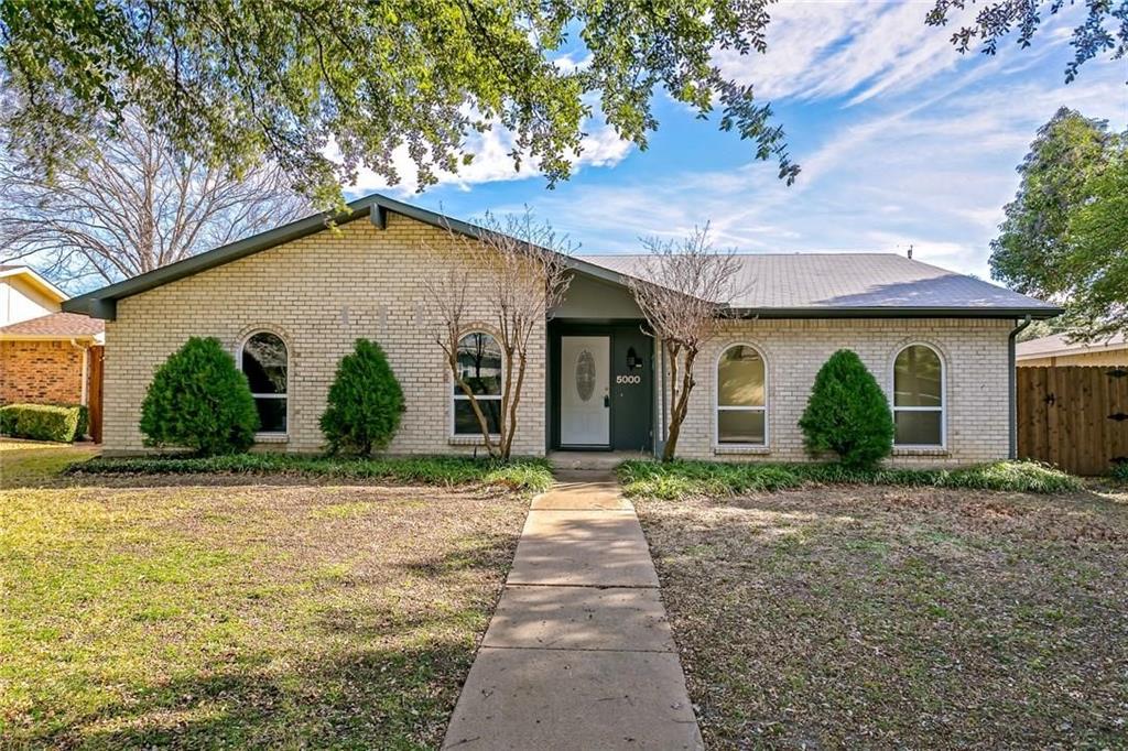 5000 Goodwin Drive Plano, TX 75023 - Photo 3 of 16 a front view of a house with garden